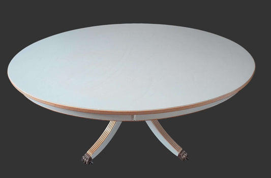 Oval white/grey table with gold trim.